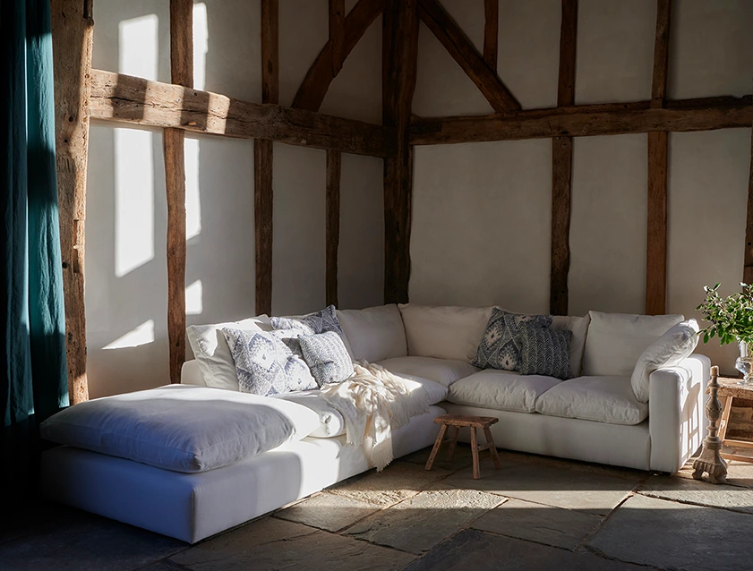 Big Softie Straight Arm Large Corner Group RHF and Footstool in Romo Linara Coconut with Scatters in William Yoeward Nizhoni Indigo & Malla Indigo