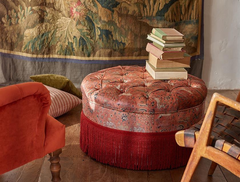 Burford Footstool in V&A Threads of India Opulent Velvets Lahore Dynasty Flame with fringe in Sophie Bullion Fringe Currant Burford Footstool in V&A Threads of India Opulent Velvets Lahore Dynasty Flame with fringe in Sophie Bullion Fringe Currant
